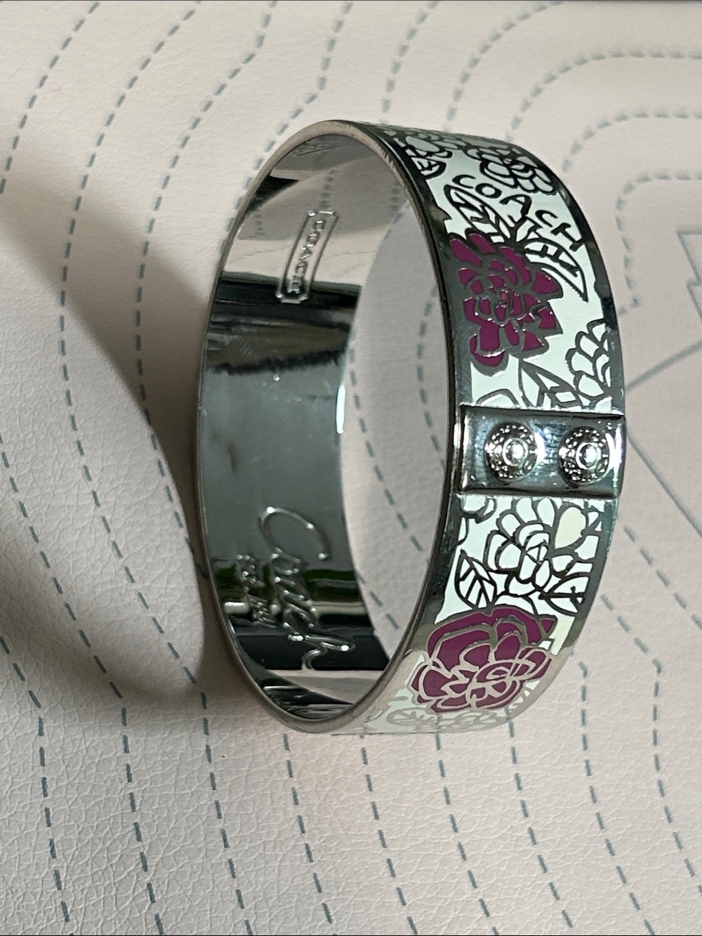 Coach Silver-Tone Floral Enamel Bangle with Pink Accents